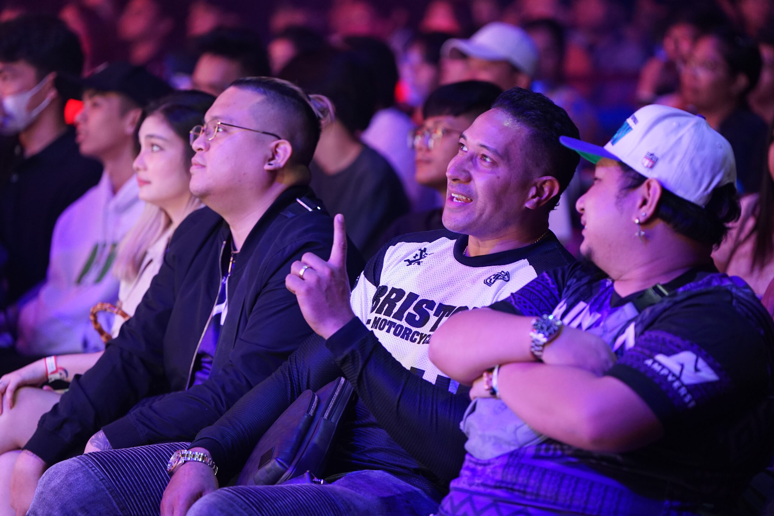 Eric"Eruption" Tai watches the MPL live with friends.