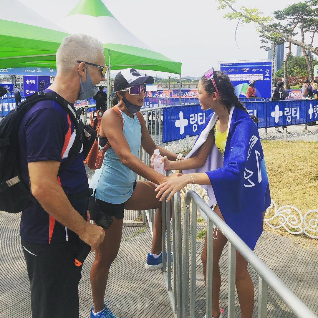 Mark Ellis and Doray Ellis with Kira Ellis after a race