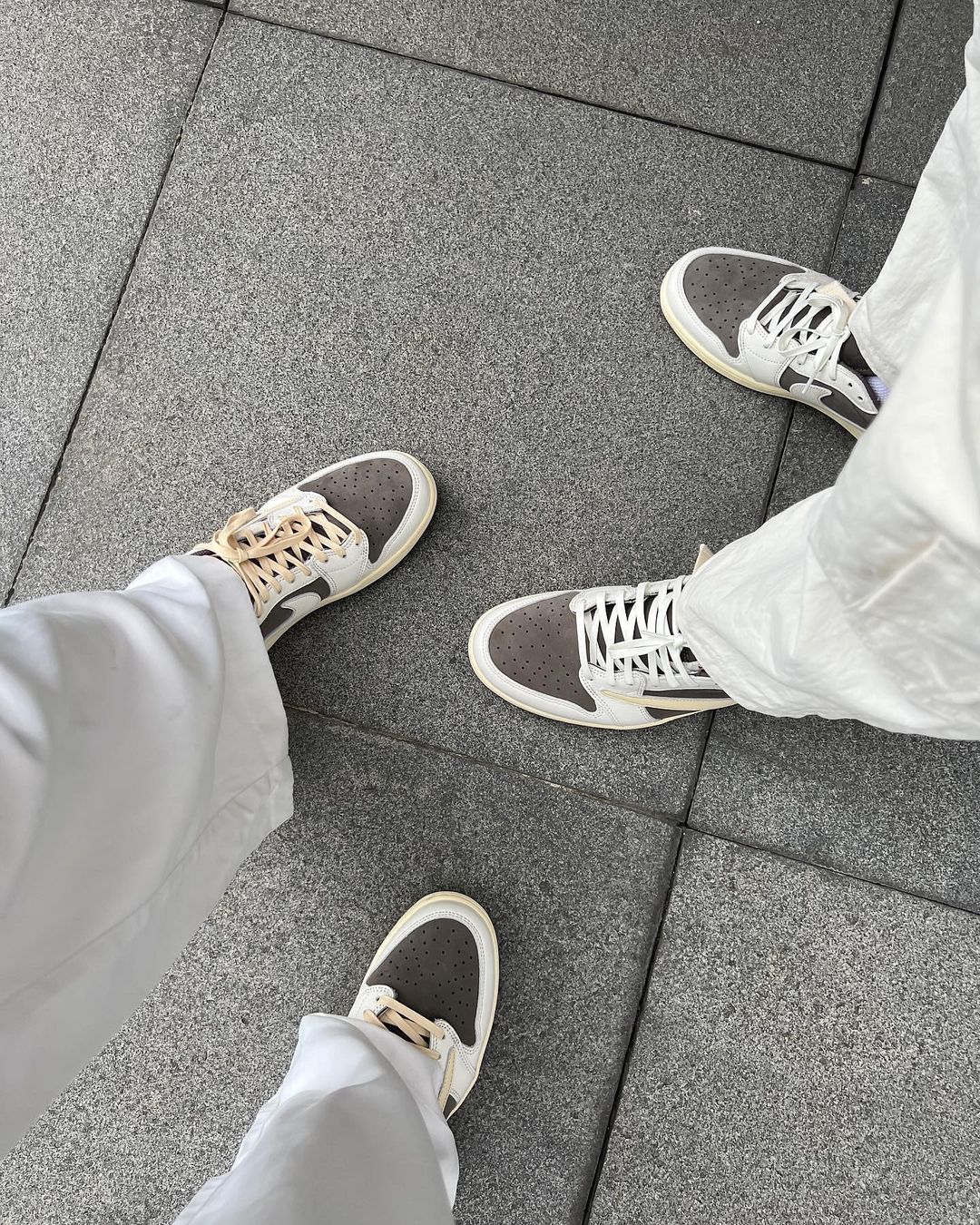 Kim Kianna Dy and Dwight Ramos wearing Air Jordan 1 Low x Travis Scott in'Reverse Mocha'