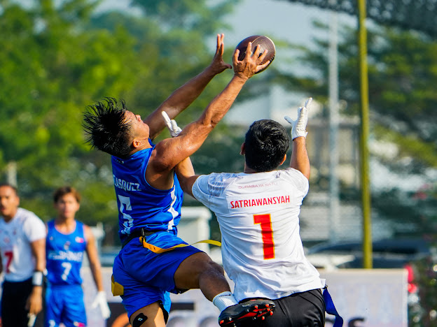 Aaron Velasquez playing flag football in Manila