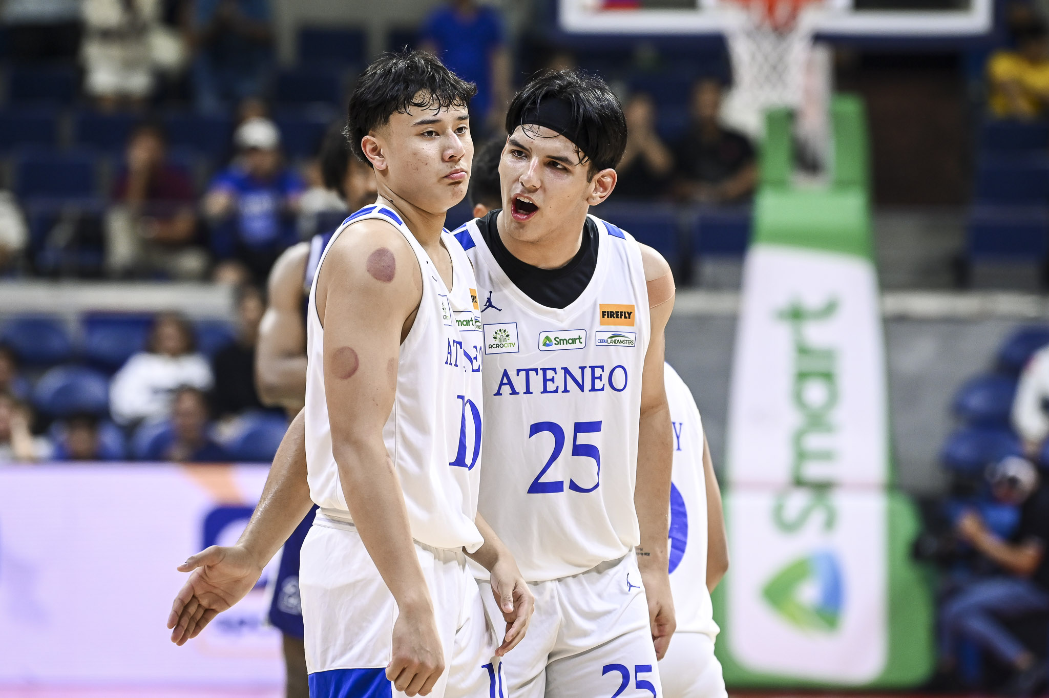 The Ateneo Blue Eagles' Kris Porter and Shawn Tuano