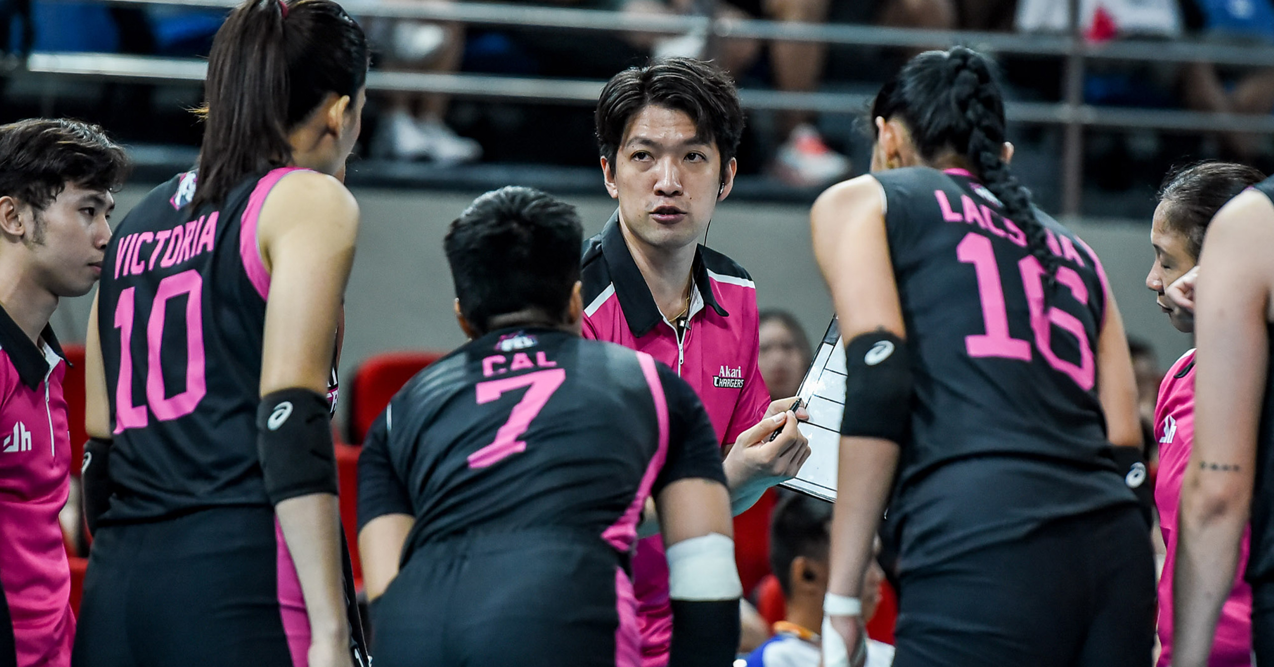 Shot of an Akari Chargers timeout with head coach Taka Minowa