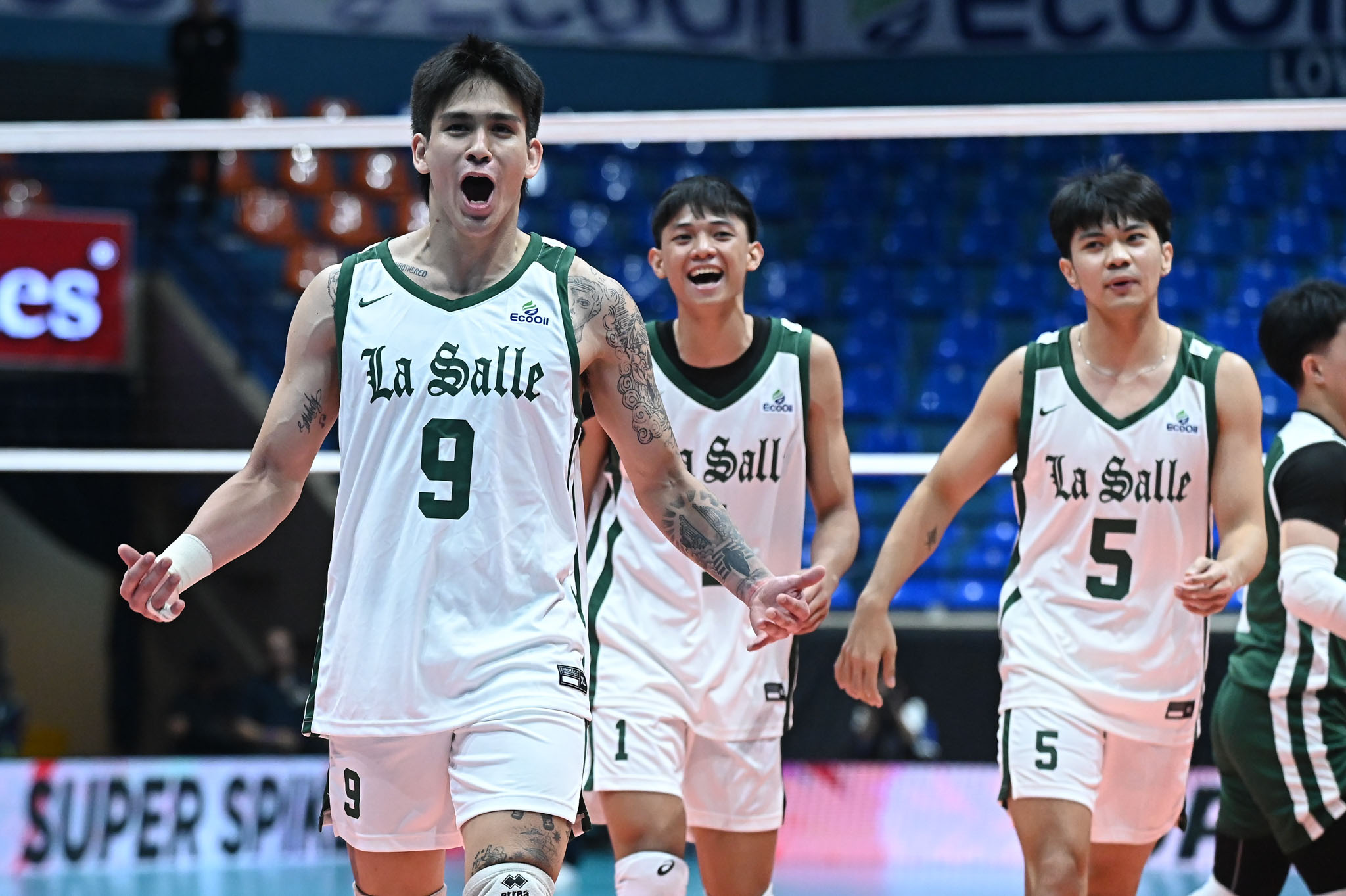 Noel Kampton with his DLSU teammates Uriel Mendoza [jersey no. 1] and Eco Adajar [jersey no. 5].