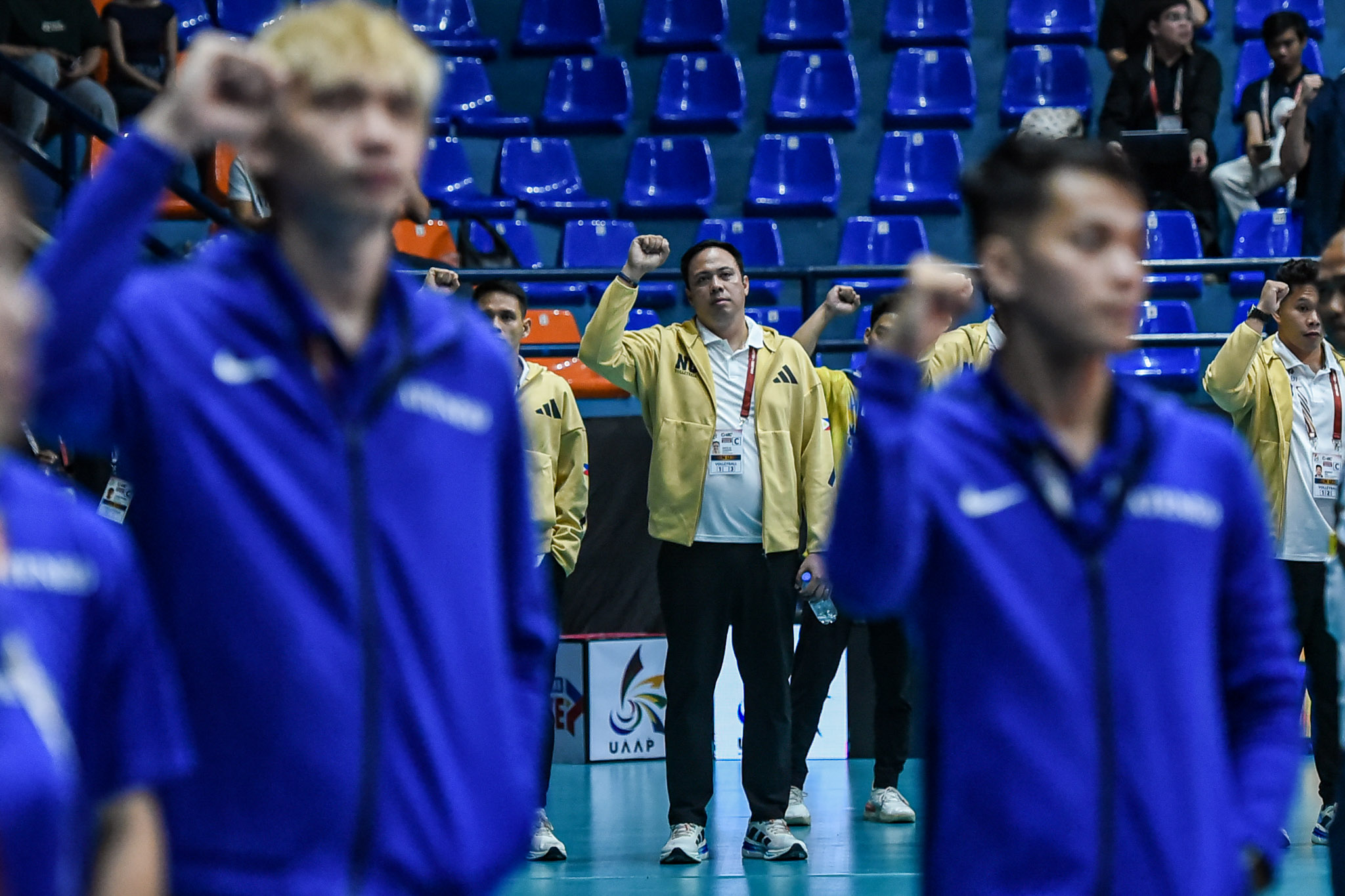 Dante Alinsunurin with his former NU players Vince Mangulabnan and Peter Torres in the background.