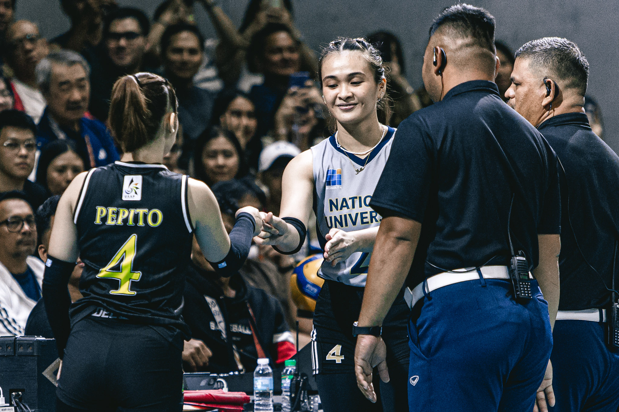 Bella Belen during the provisional coin toss with UST captain and longtime friend Detdet Pepito.