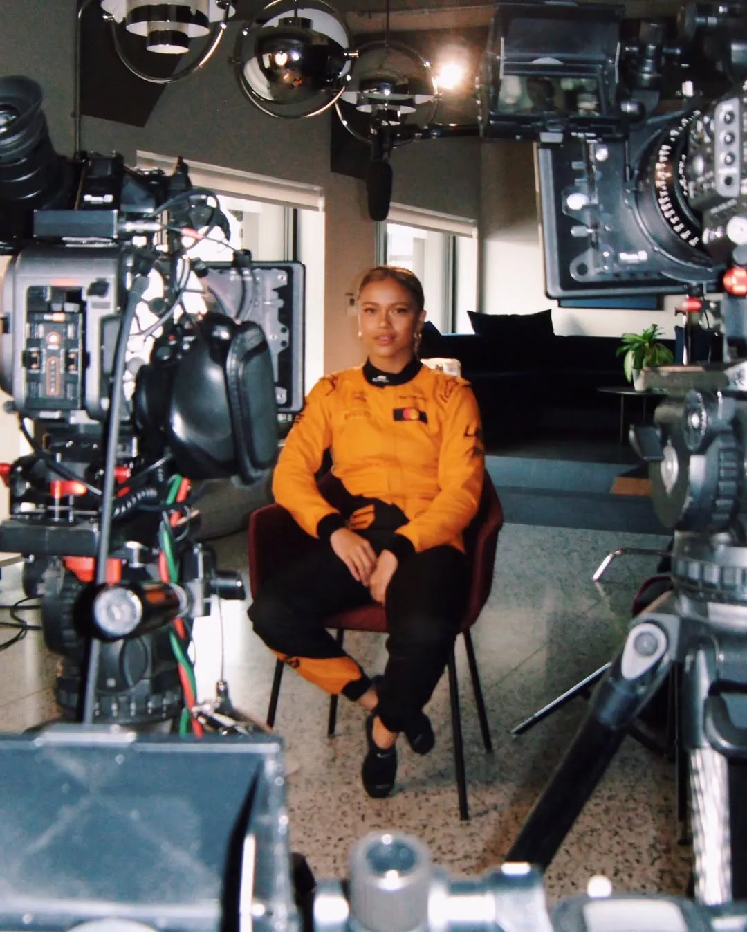 A shot of Bianca Bustamante filming the F1 Academy documentary series for Netflix