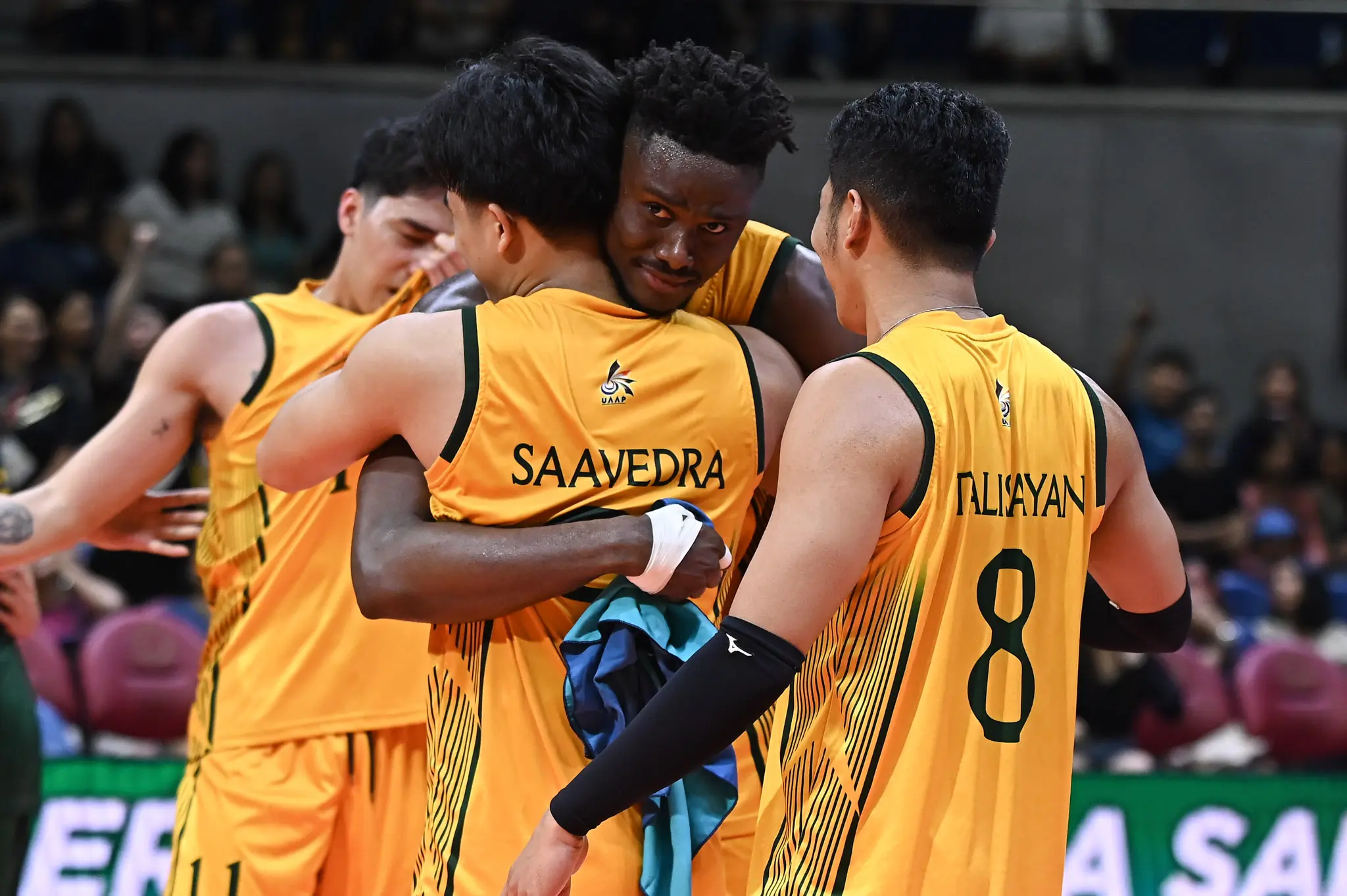 Uaap 87 mvb feu vs dlsu- doula ndongala-7972 1 - the game Middle blocker Doula Ndongala shares an emotional hug with senior Dryx Saavedra