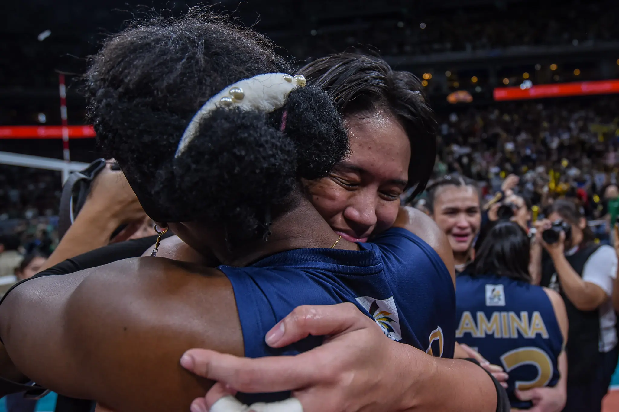Uaap 87 wvb finals g2 dlsu vs nu - alyssa solomon-1340 - the game Alyssa Solomon celebrates with teammate Aisha Bello after winning the UAAP Season 87 Women's Volleyball championship.