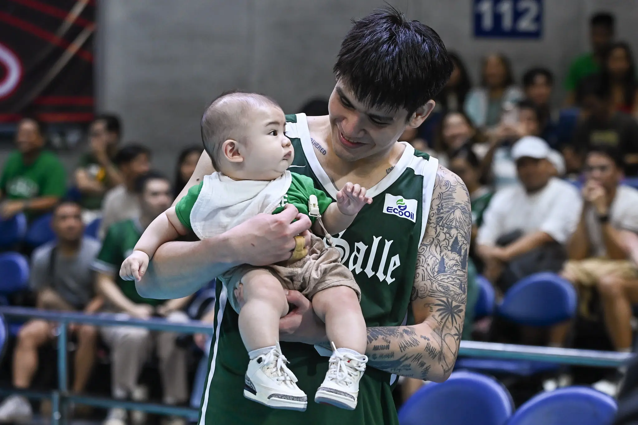 Noel Kampton with Baby Leon during his UAAP farewell