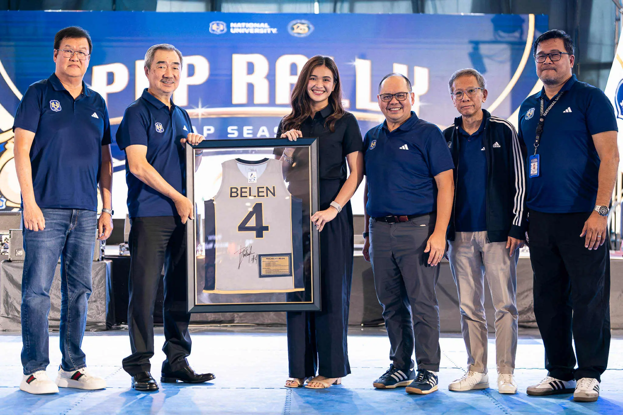 Bella Belen was accompanied by school officials in her jersey retirement presentation.