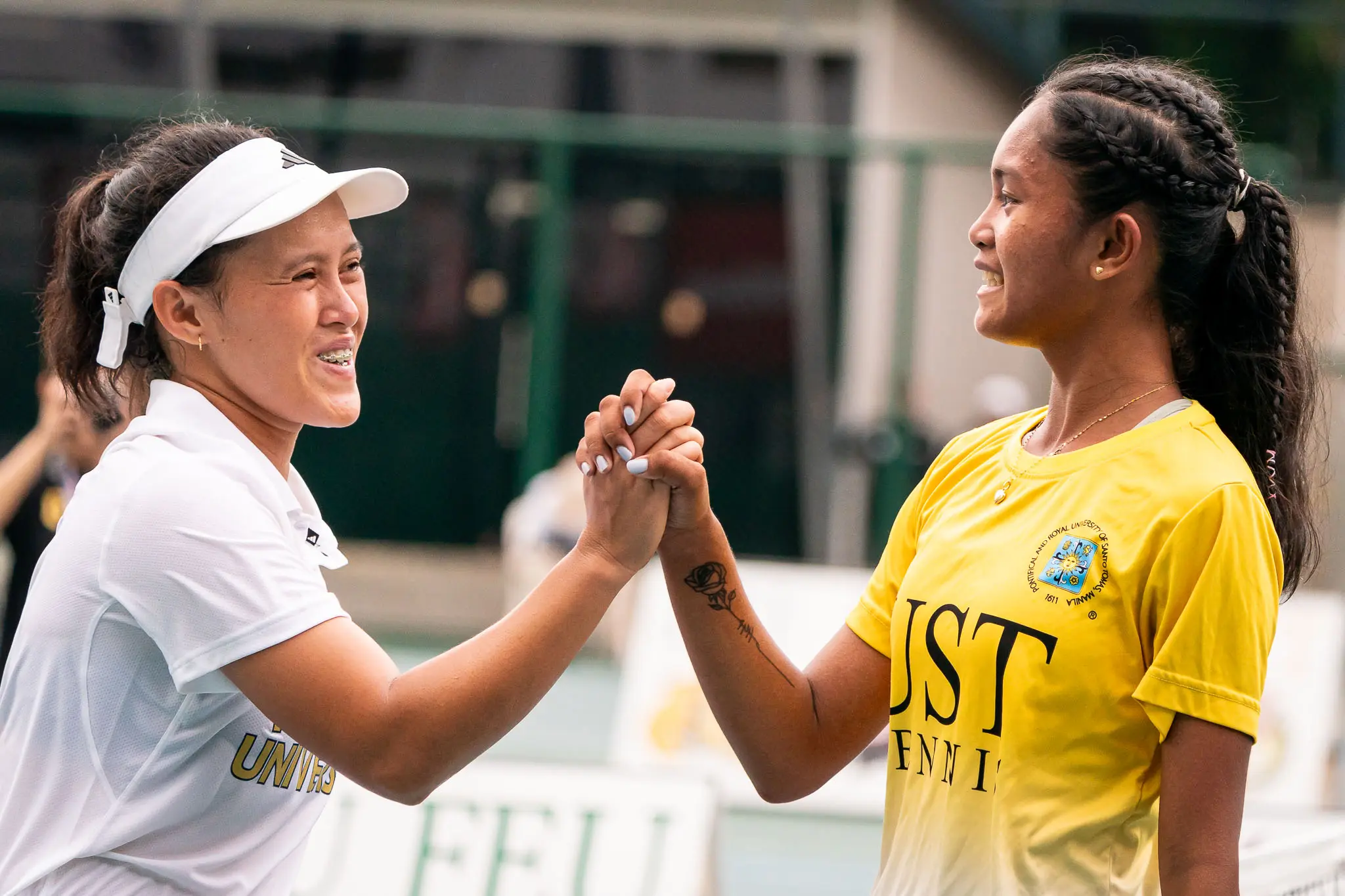 Uaap s87 women's tennis - elizabeth abarquez & mica emana-01061 - the game