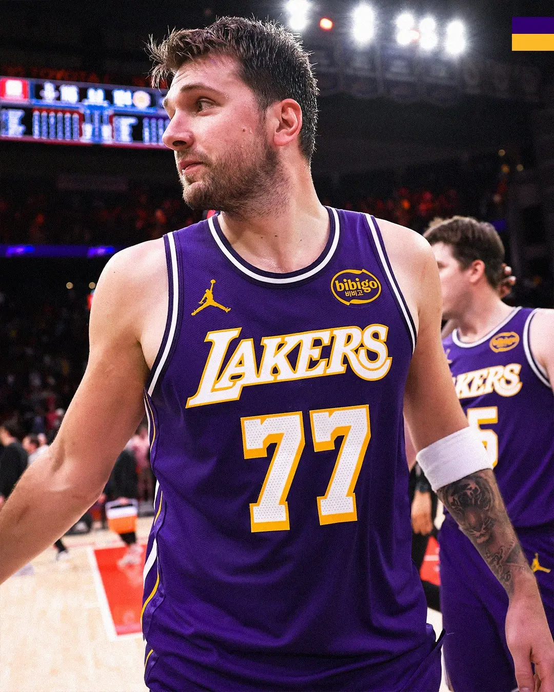 Saveclipapp_652408891_1479271540228353_2410569312526990227_n - the game Basketball player in a Lakers purple jersey with number 77, standing on the court and looking to the left during a game.