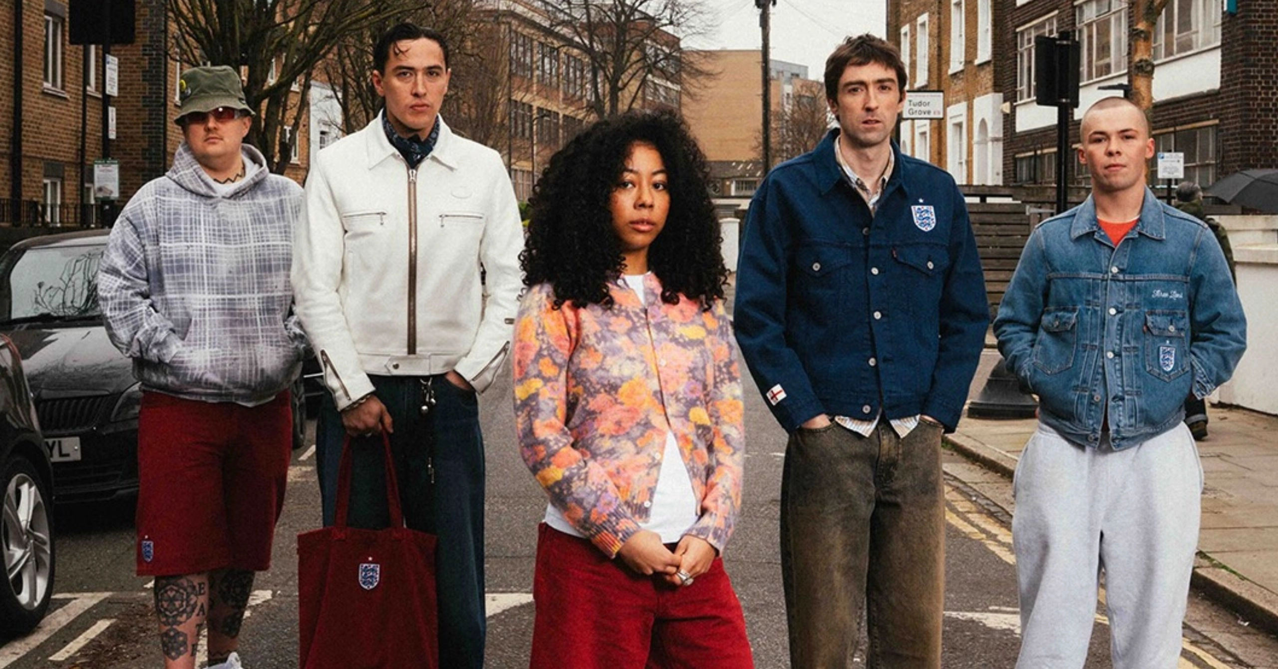 England x levis - the game Group of five young adults standing on a city street, looking at the camera, wearing casual jackets and jeans.