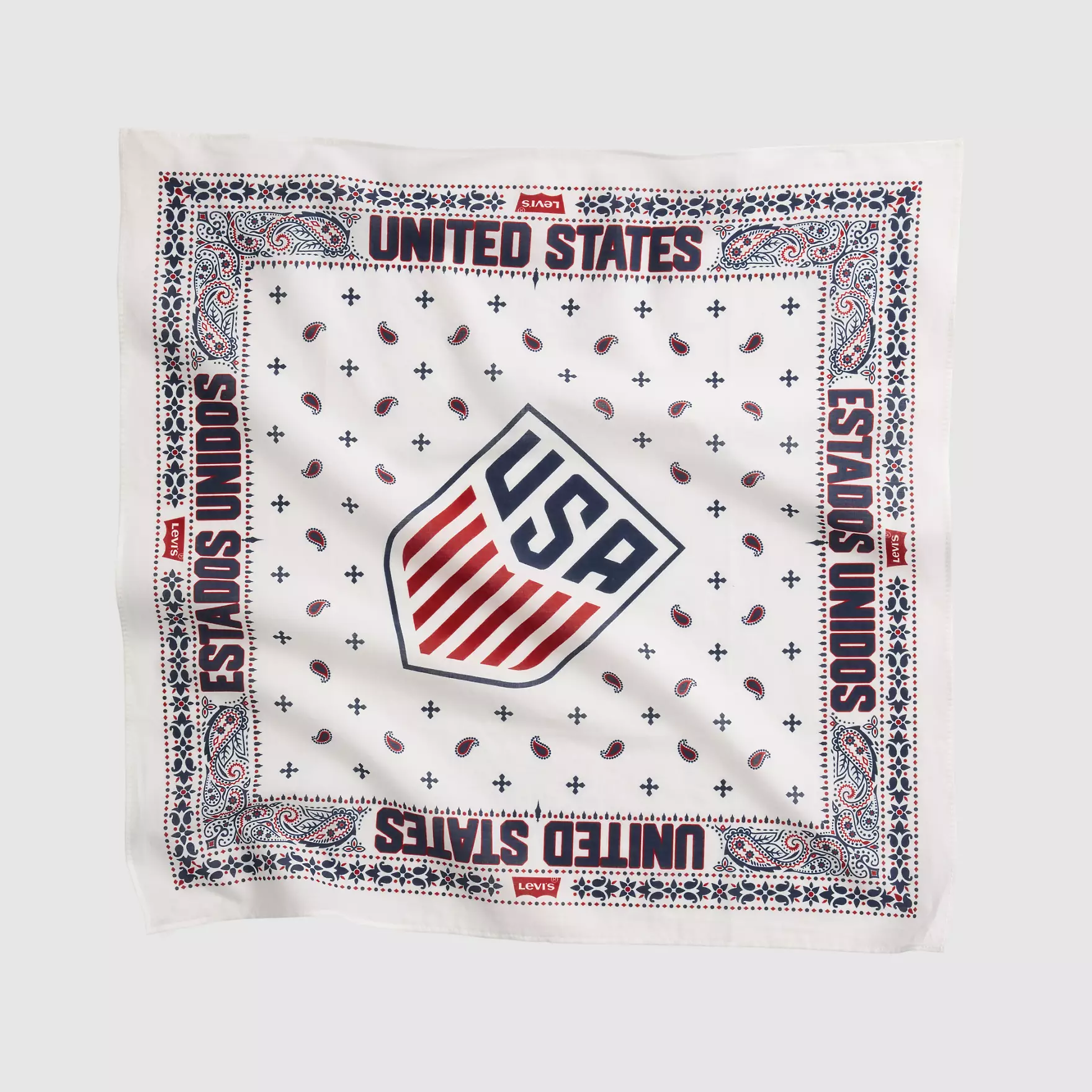 White bandana-patterned fabric with red/blue borders, Levi's branding, and a central US shield motif in red and blue.