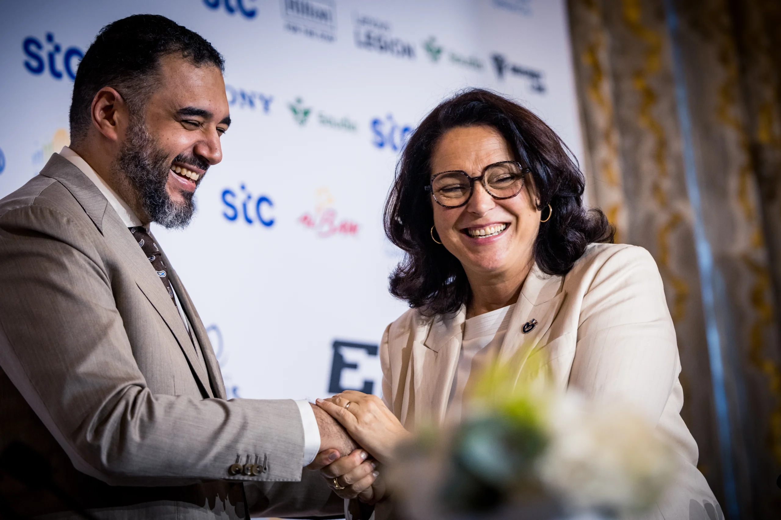 HRH Faisal bin Bandar bin Sultan (left) exchange greetings with Marina Ferrari, French Minister of Sports, Youth, and Community Life (right).